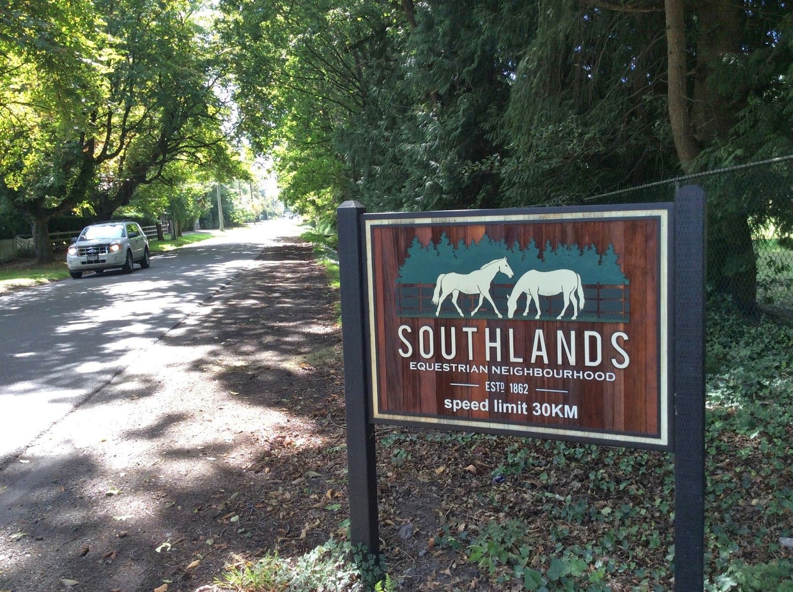 Southlands equestrian neighborhood sign on a quiet treed road—perfect for private estates and custom smart home technology