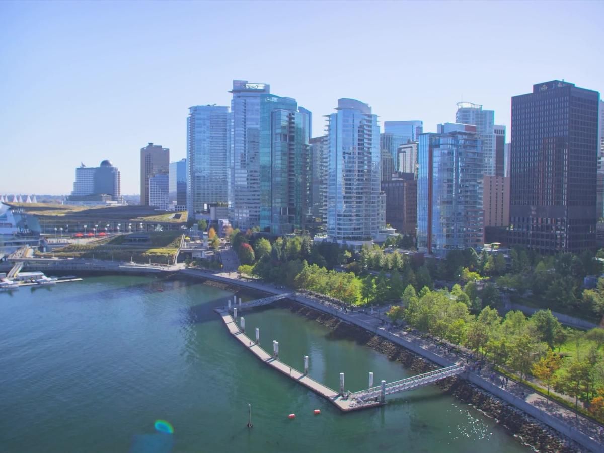 Luxury waterfront high-rises in Vancouver’s Coal Harbour overlooking Burrard Inlet—ideal for smart condo living with Crestron, Lutron, and Control4